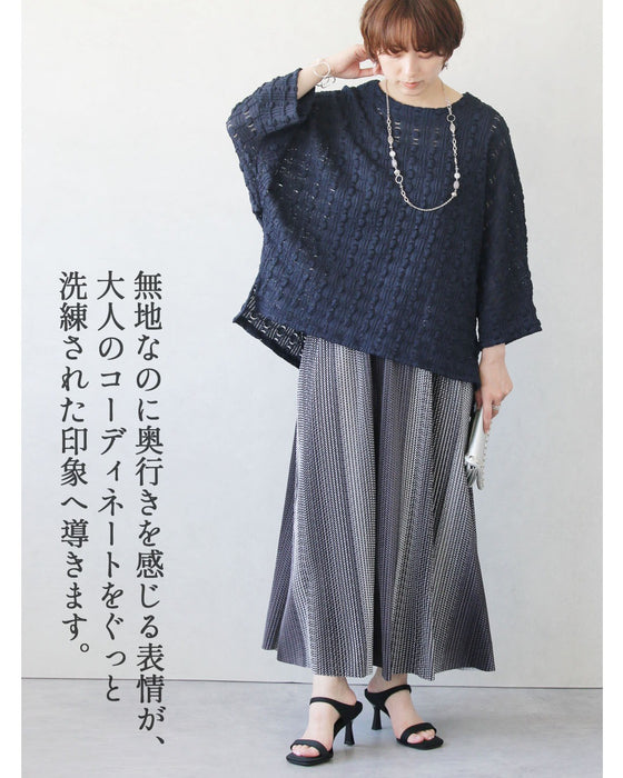 表情豊かな立体感。ぽこぽこ素材ドルマントップス