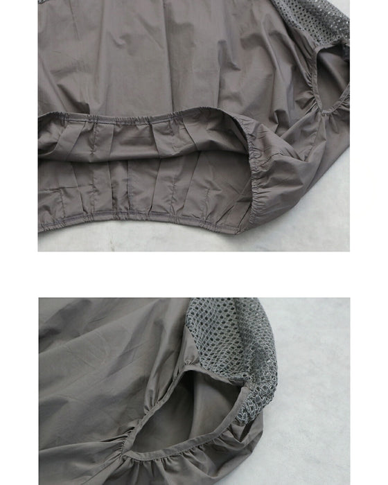 軽やかさを纏う。肩メッシュ切替の立体フォルムトップス