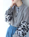 Striped blouse top with lace pattern and ruffled sleeves