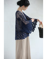 A teardrop-shaped knit lace cardigan with a flared hem