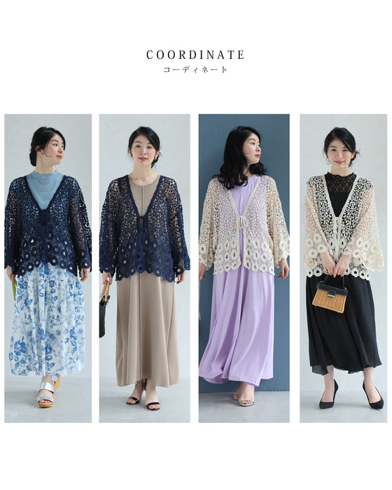 A teardrop-shaped knit lace cardigan with a flared hem
