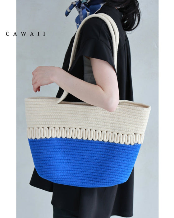 A refreshing two-tone rope tote bag