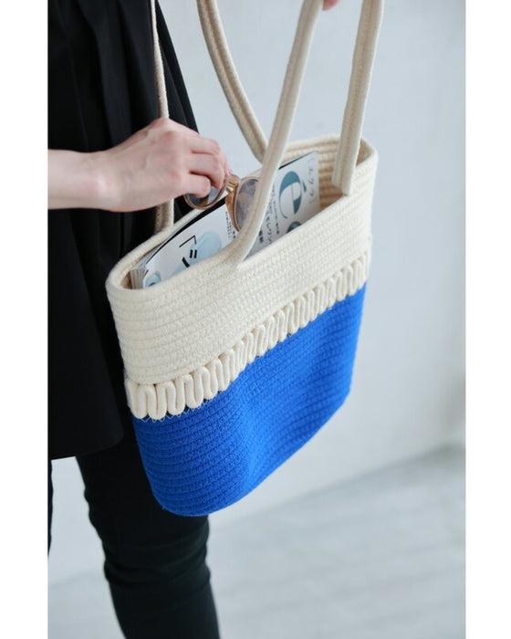 A refreshing two-tone rope tote bag