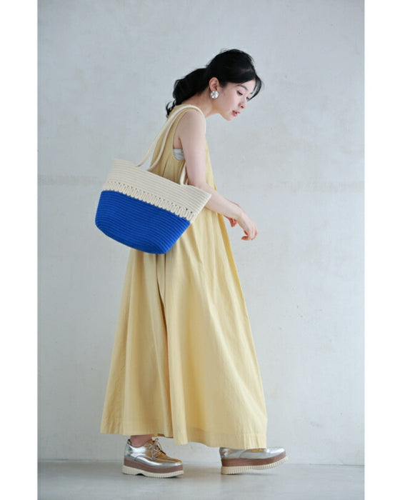 A refreshing two-tone rope tote bag