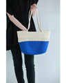 A refreshing two-tone rope tote bag