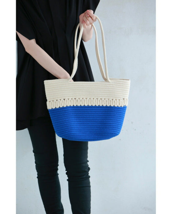 A refreshing two-tone rope tote bag
