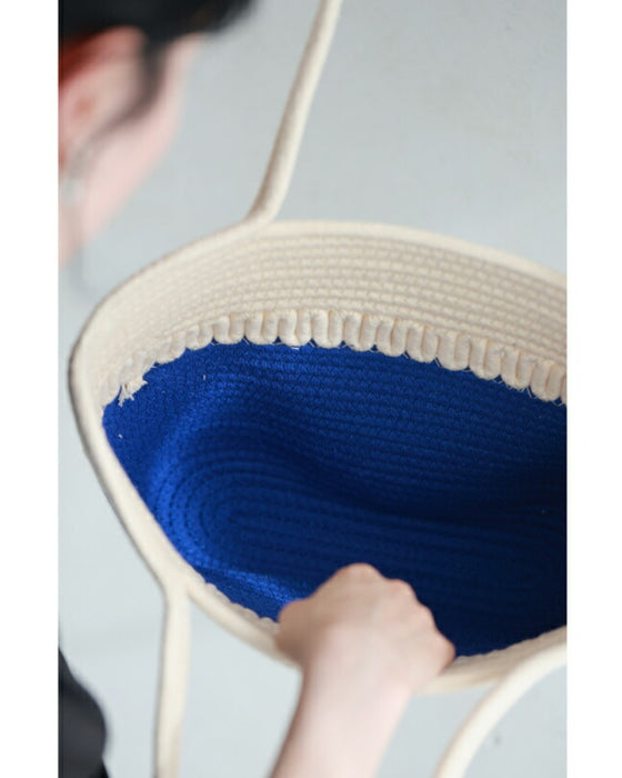 A refreshing two-tone rope tote bag