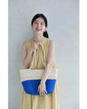 A refreshing two-tone rope tote bag