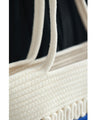 A refreshing two-tone rope tote bag