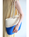 A refreshing two-tone rope tote bag