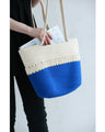 A refreshing two-tone rope tote bag