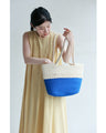 A refreshing two-tone rope tote bag