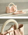 Glossy pearl-handled mini bag with strap