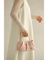 Glossy pearl-handled mini bag with strap
