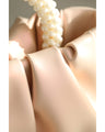 Glossy pearl-handled mini bag with strap