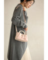 Glossy pearl-handled mini bag with strap