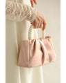 Glossy pearl-handled mini bag with strap