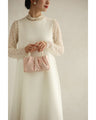 Glossy pearl-handled mini bag with strap