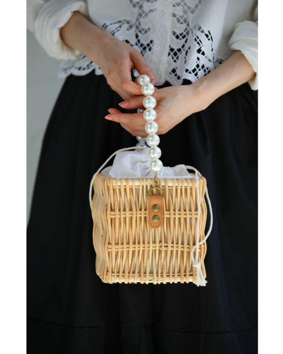 パールハンドルのスクエアかごバッグ