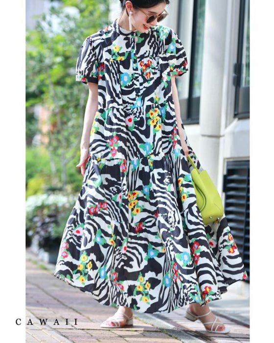 A long dress with a pop floral pattern overlapping with swaying art