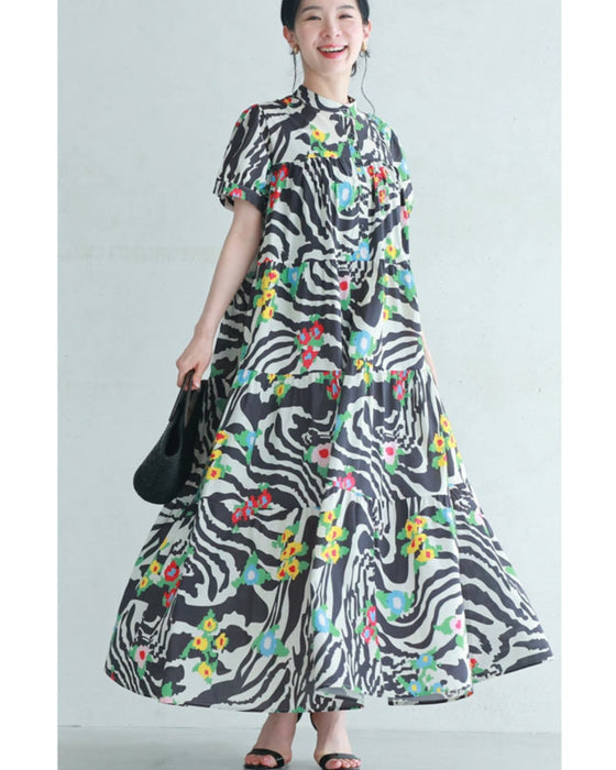 A long dress with a pop floral pattern overlapping with swaying art