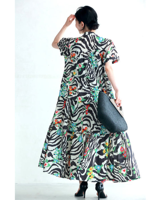 A long dress with a pop floral pattern overlapping with swaying art
