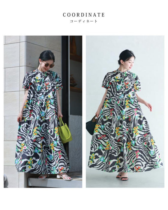 A long dress with a pop floral pattern overlapping with swaying art