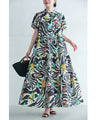 A long dress with a pop floral pattern overlapping with swaying art