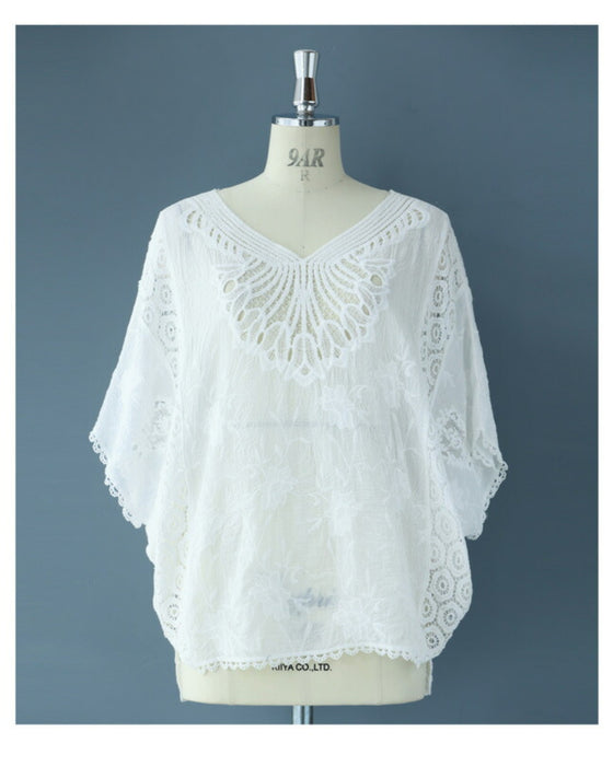 A cool dolman blouse top with embroidery and lace