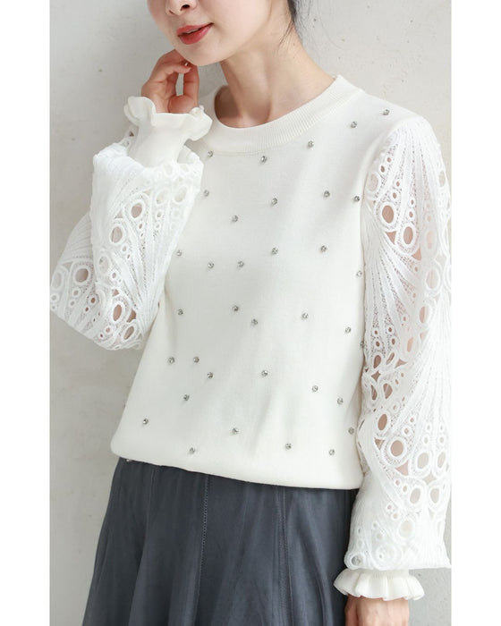 孔雀羽レース袖のビジューニットプルオーバートップス