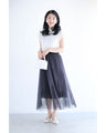 街並み浮かぶシアープリーツミディアムスカート