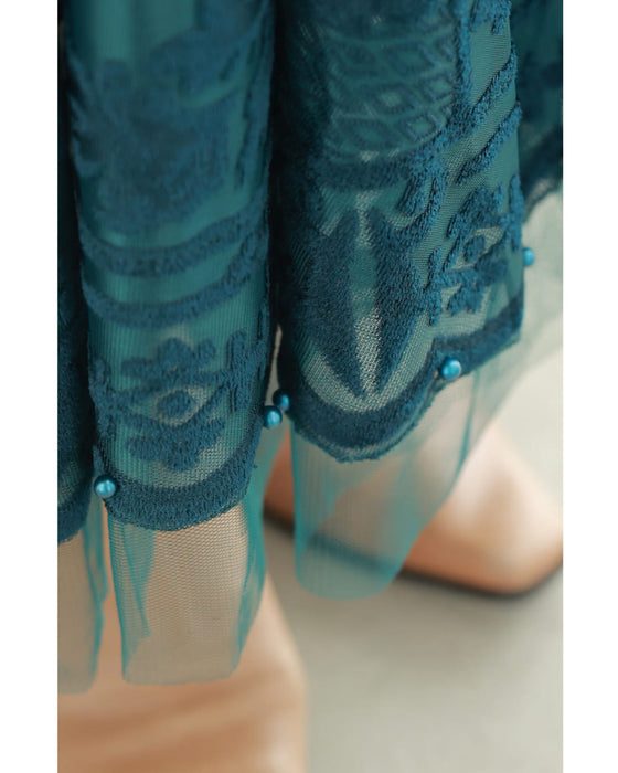 A gorgeous veiled midi skirt with a flocked pattern