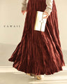 A long skirt with a velour-like texture and a wrinkled, washed look