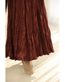 A long skirt with a velour-like texture and a wrinkled, washed look