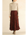 A long skirt with a velour-like texture and a wrinkled, washed look