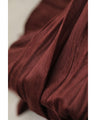 A long skirt with a velour-like texture and a wrinkled, washed look