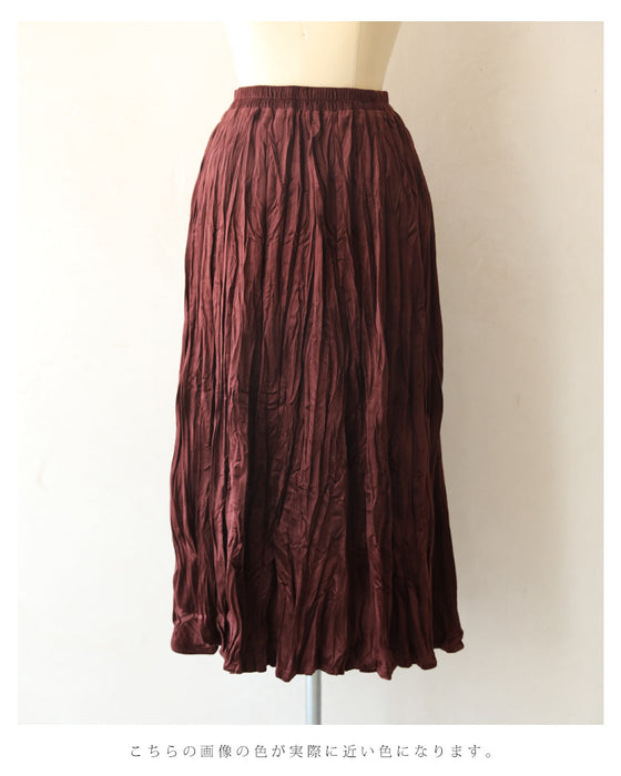 A long skirt with a velour-like texture and a wrinkled, washed look