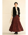 A long skirt with a velour-like texture and a wrinkled, washed look