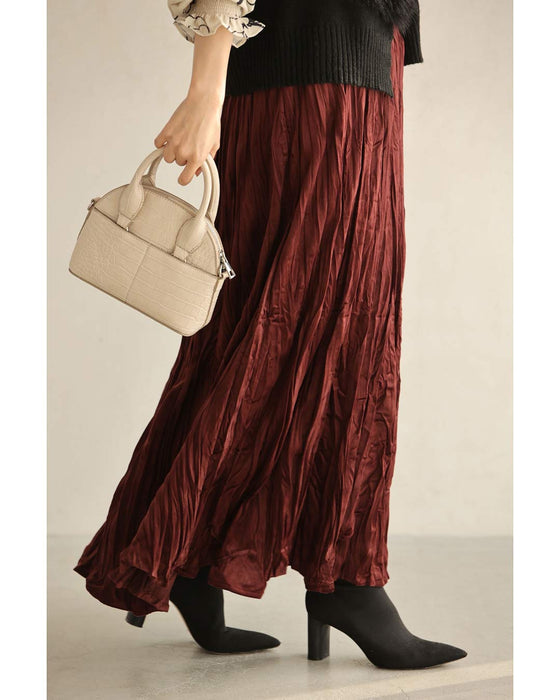 A long skirt with a velour-like texture and a wrinkled, washed look