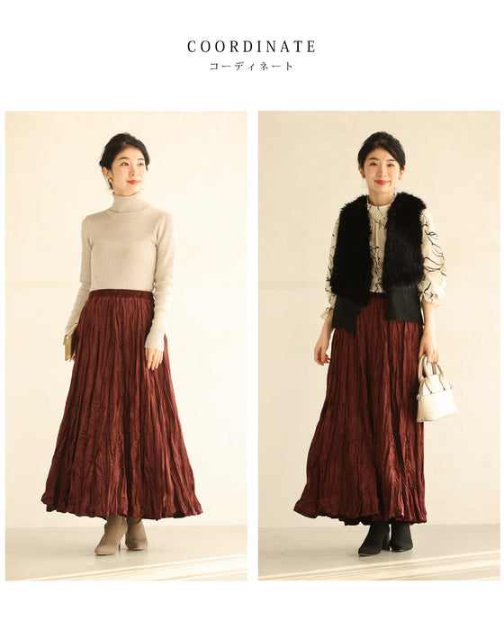 A long skirt with a velour-like texture and a wrinkled, washed look