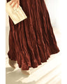A long skirt with a velour-like texture and a wrinkled, washed look