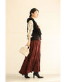 A long skirt with a velour-like texture and a wrinkled, washed look