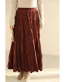 A long skirt with a velour-like texture and a wrinkled, washed look
