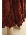 A long skirt with a velour-like texture and a wrinkled, washed look