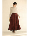 A long skirt with a velour-like texture and a wrinkled, washed look