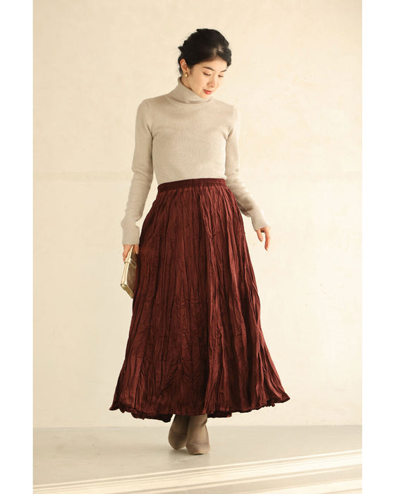 A long skirt with a velour-like texture and a wrinkled, washed look