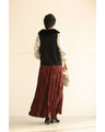 A long skirt with a velour-like texture and a wrinkled, washed look