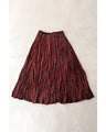 A long skirt with a velour-like texture and a wrinkled, washed look