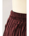 A long skirt with a velour-like texture and a wrinkled, washed look