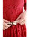 A long dress made entirely of lace and featuring a red dahlia (with belt)